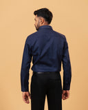 Model back view wearing navy blue Giza dobby shirt