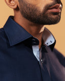 Half side collar view of navy blue Giza dobby shirt on model