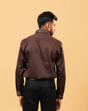 Model back view wearing dark brown Giza satin shirt