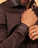 Cuff detail of dark brown Giza satin shirt on model