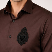 Dark brown satin shirt with signature patch detail on chest
