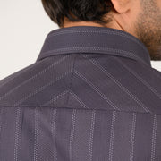 Texture close-up of luxury dark grey Giza satin fabric in herringbone weave