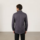 Model showing the back fit and structure of dark grey Giza satin shirt