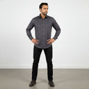 Model wearing The Obsidian Regent dark grey herringbone shirt in executive style