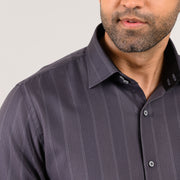 Close-up of signature double-button collar on dark grey Giza satin shirt