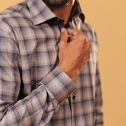 Cuff detail of dark grey plaid Giza twill shirt on model