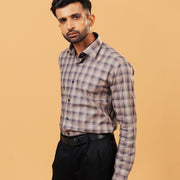 Model wearing dark grey plaid Giza twill shirt front view