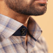 Half side collar view of dark grey plaid Giza twill shirt on model