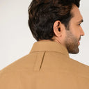 Dark sand shirt for men worn by model showing back fit and style