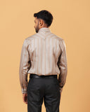 Model back view wearing earth tone satin stripe shirt