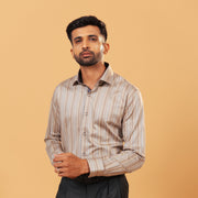 Model wearing earth tone satin stripe shirt front view