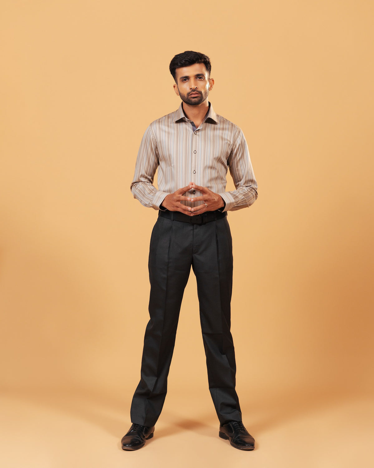 Model wearing earth tone satin stripe shirt full front view