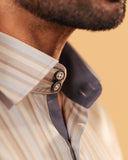 Half side collar view of earth tone satin stripe shirt on model