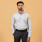 Model wearing ivory herringbone shirt front view