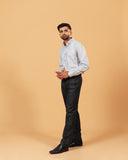 Model wearing ivory herringbone shirt full front view