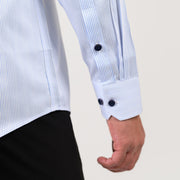 Two-button barrel cuff detail on light blue pinstripe satin shirt