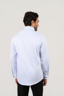 Model wearing light blue pinstripe shirt showing back fit and structure
