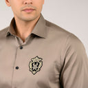 Light brown satin shirt with signature patch detail on chest