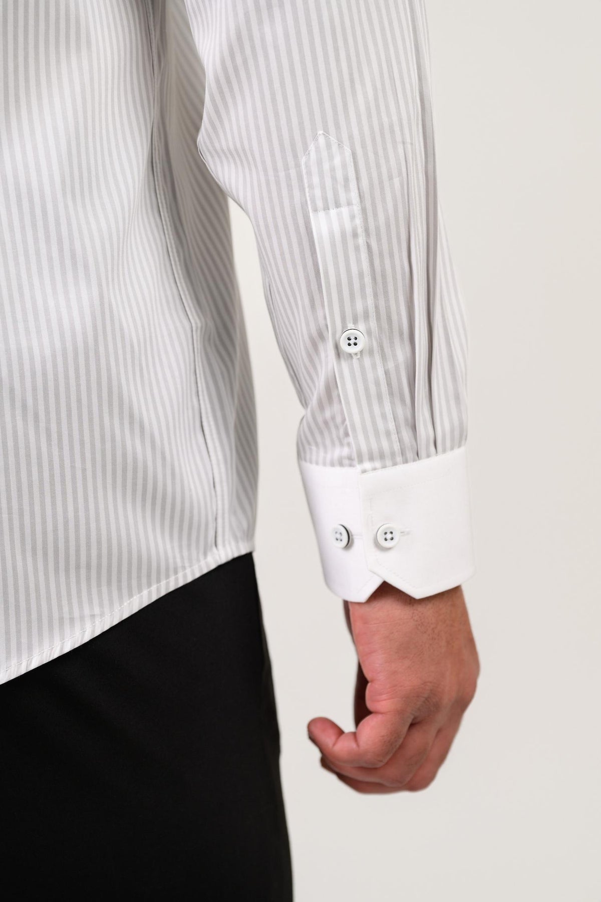 Light grey satin shirt cuff detail with refined candy stripe finish