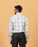 Model back view wearing light grey windowpane twill shirt