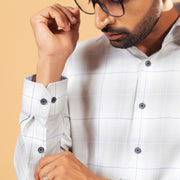 Cuff detail of light grey windowpane twill shirt on model