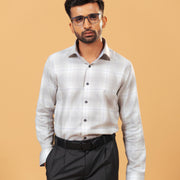 Model wearing light grey windowpane twill shirt front view