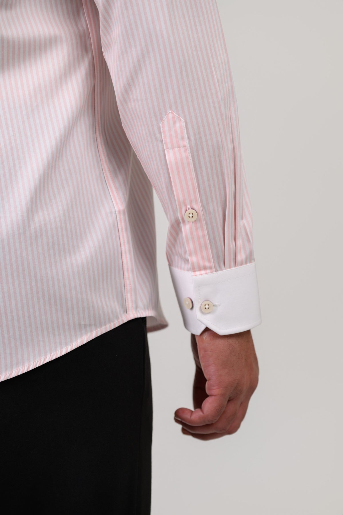 Light pink shirt cuff detail with white contrast cuff finish
