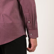 Maroon shirt cuff detail with refined micro-stripe texture