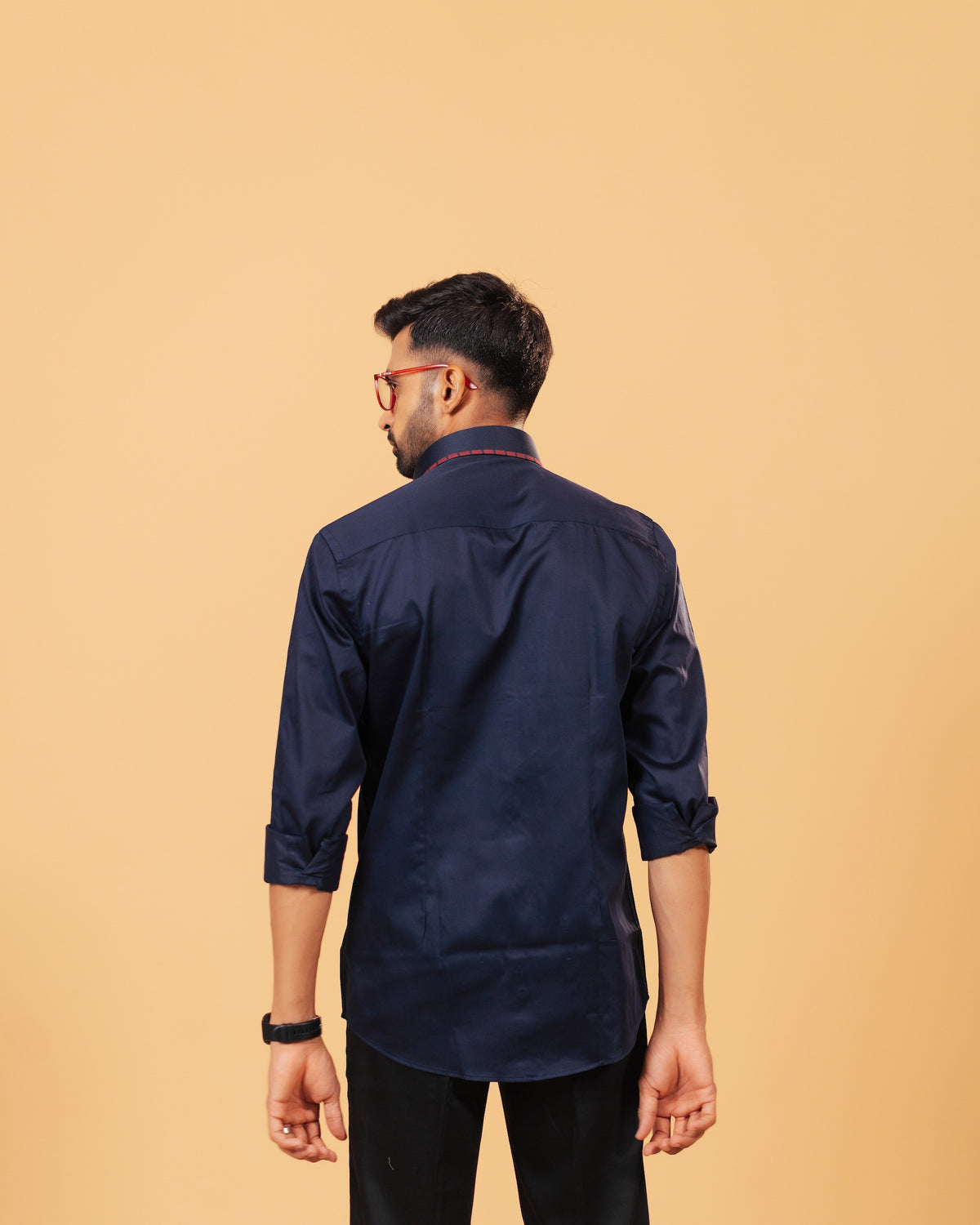 Model back view wearing navy blue Giza satin shirt