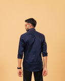 Model back view wearing navy blue Giza satin shirt