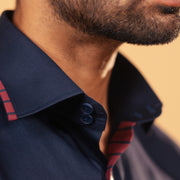Half side collar view of navy blue Giza satin shirt on model