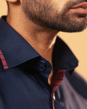 Half side collar view of navy blue Giza satin shirt on model