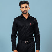 Model wearing black twill embroidered patch shirt front view