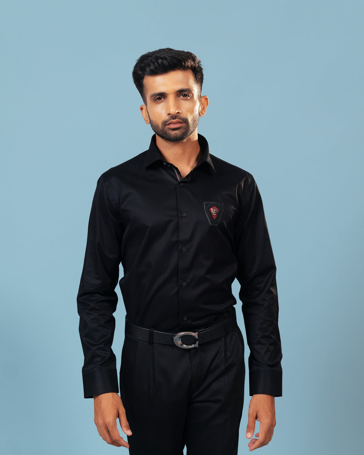Model wearing black twill embroidered patch shirt front view