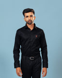 Model wearing black twill embroidered patch shirt front view