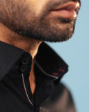 Half side collar view of black twill embroidered patch shirt on model