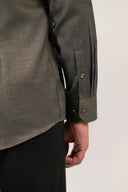 Olive green herringbone shirt cuff detail in premium cotton fabric