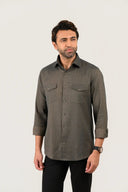 Olive green shirt for men worn by model showing full front view with folded sleeves