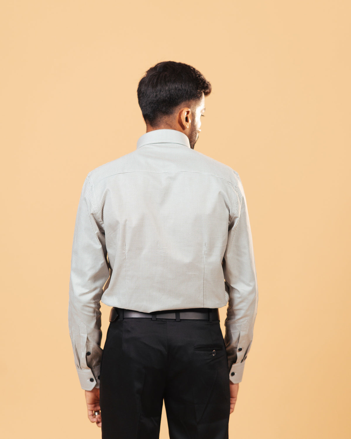 Model back view wearing olive and white Oxford houndstooth shirt