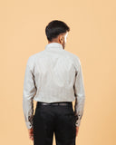 Model back view wearing olive and white Oxford houndstooth shirt
