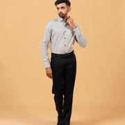Model wearing olive and white Oxford houndstooth shirt full front view