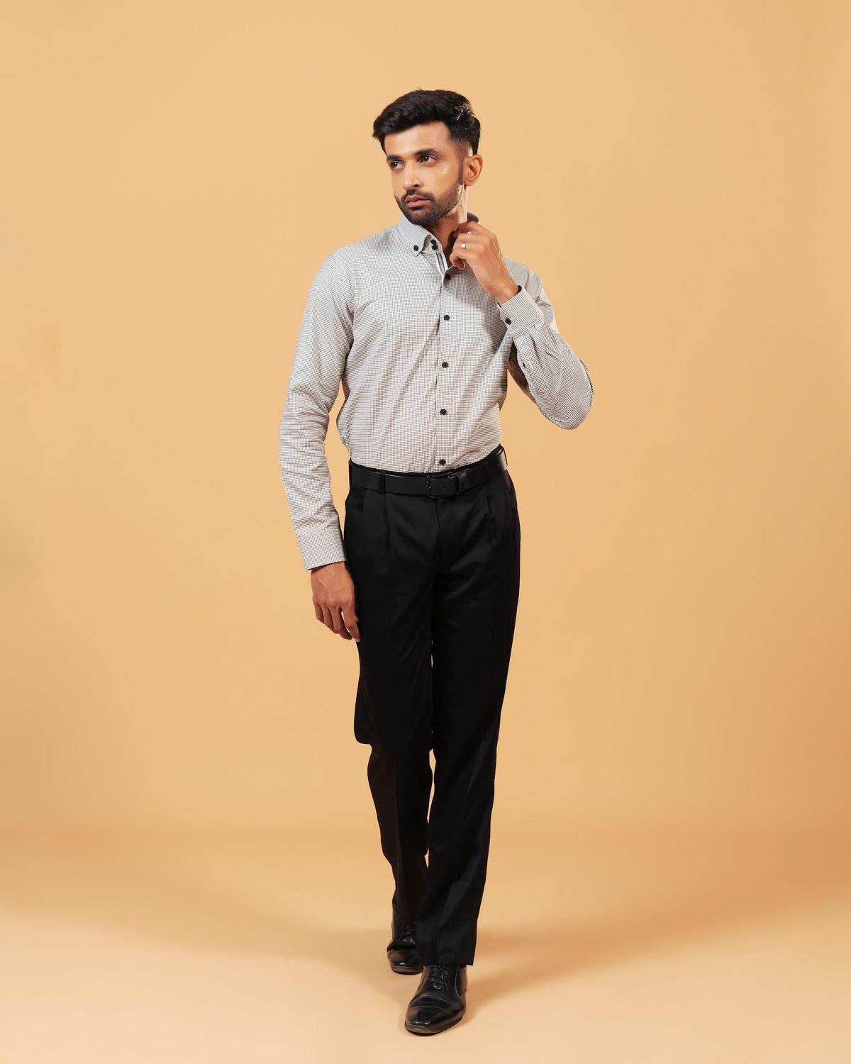 Model wearing olive and white Oxford houndstooth shirt full front view