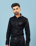 Model wearing black twill leather wolf patch shirt front view