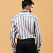 Model back view wearing silver wide stripe satin shirt