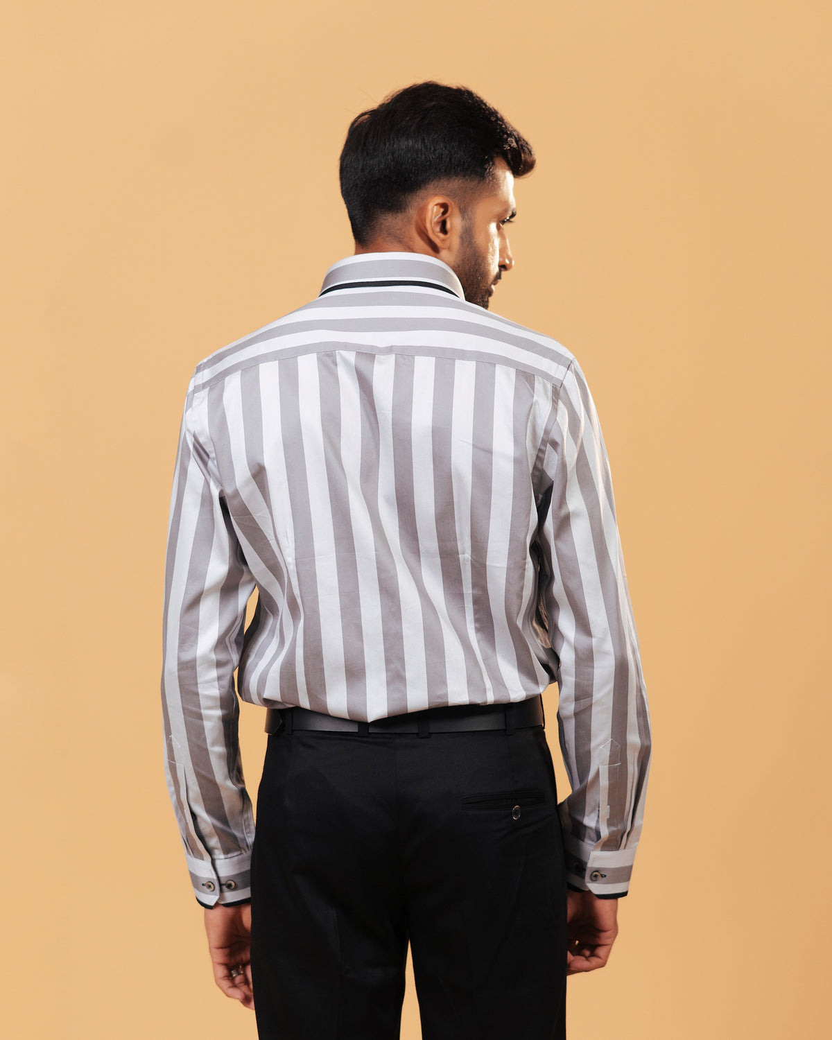 Model back view wearing silver wide stripe satin shirt