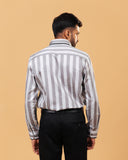 Model back view wearing silver wide stripe satin shirt