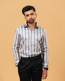 Model wearing silver wide stripe satin shirt front view