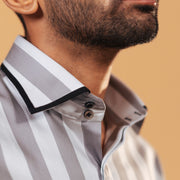 Half side collar view of silver wide stripe satin shirt on model