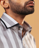 Half side collar view of silver wide stripe satin shirt on model