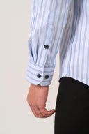 Sky blue twill shirt cuff detail with refined striped finish